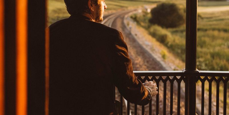 A guest looking out over the line from the Royal Scotsman